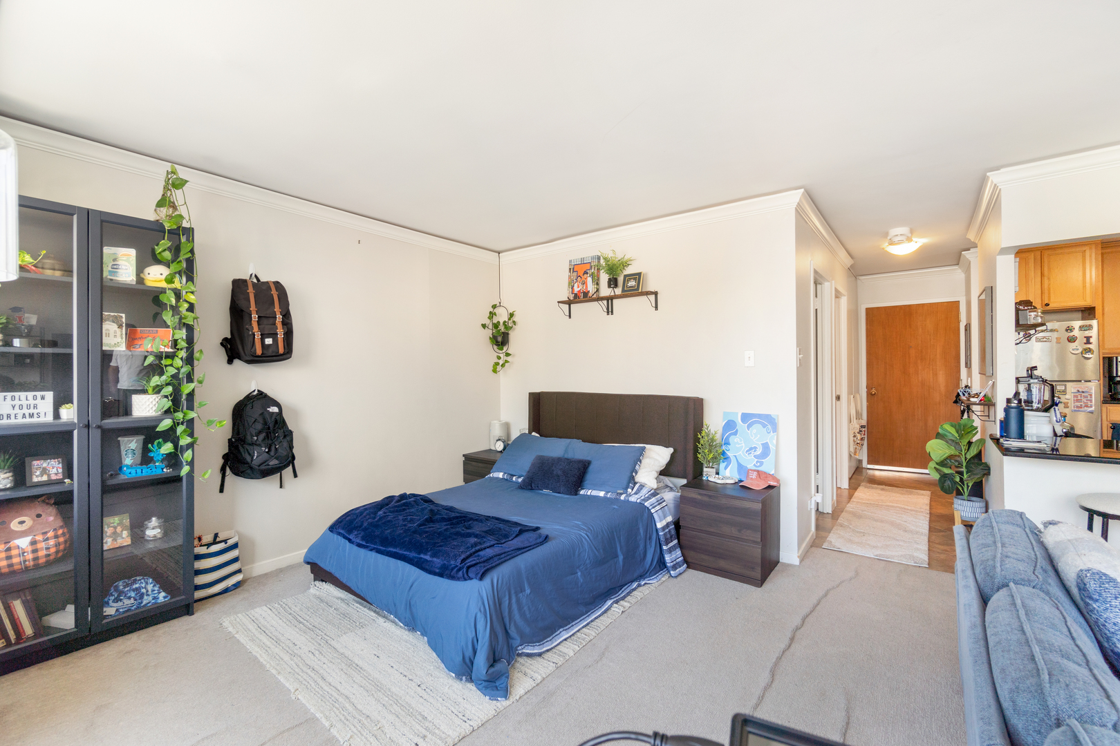 211 East Ohio Street, Unit 2806 Chicago, IL 60611 - Photo 6 of 16 a bedroom with furniture and wooden floor