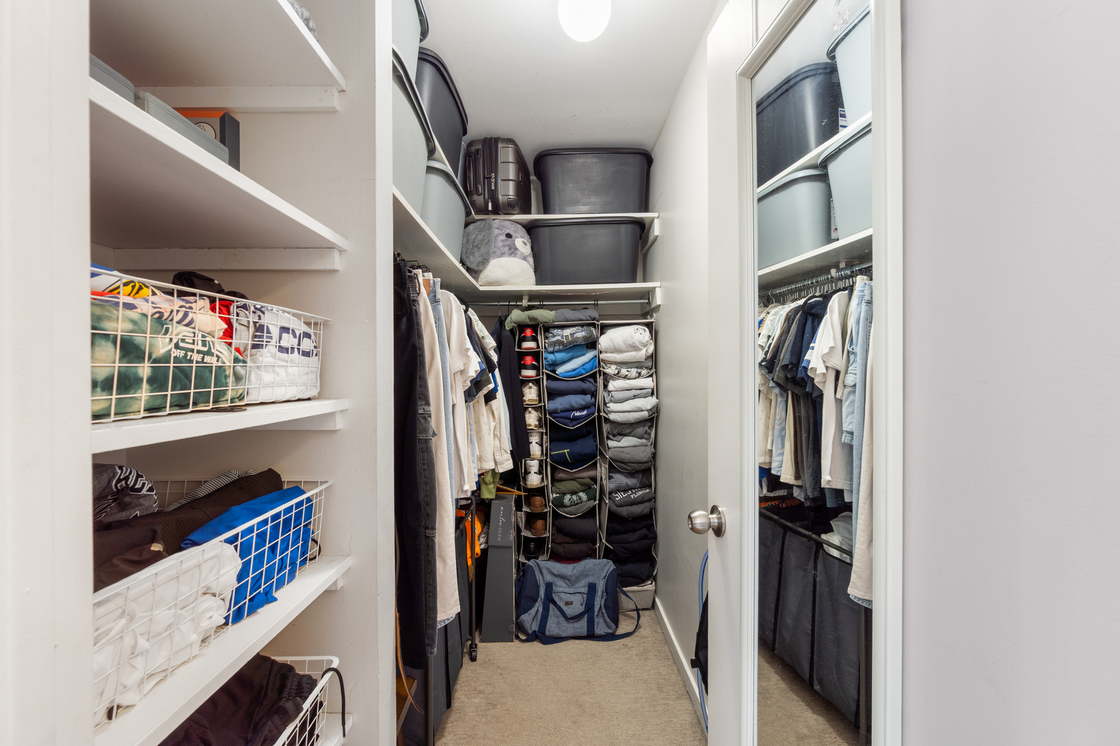 211 East Ohio Street, Unit 2806 Chicago, IL 60611 - Photo 10 of 16 a view of walk in closet with clothes and shoes