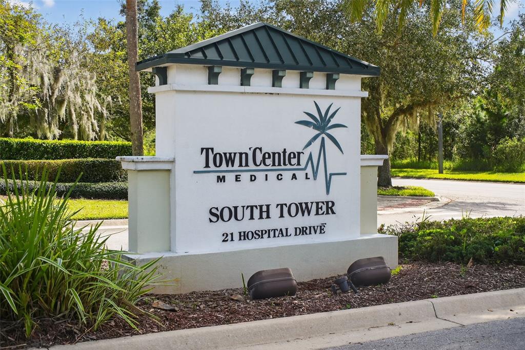 469 Bulldog Drive, Unit 1 Palm Coast, FL 32164 - Photo 11 of 54 a sign on the side of the road