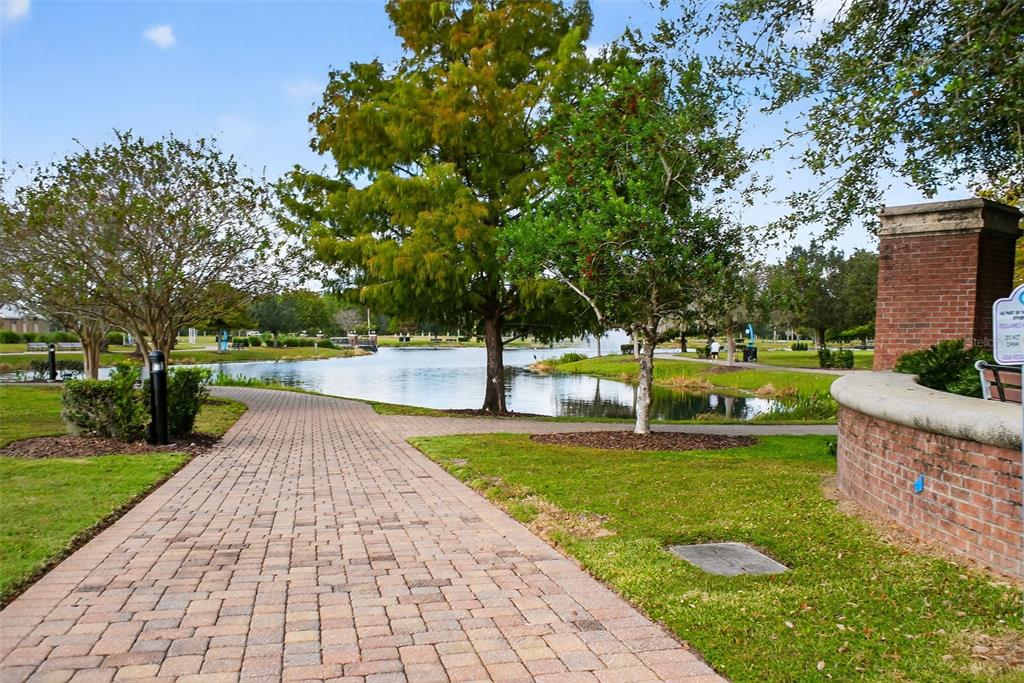 469 Bulldog Drive, Unit 1 Palm Coast, FL 32164 - Photo 13 of 54 a view of a swimming pool with a garden