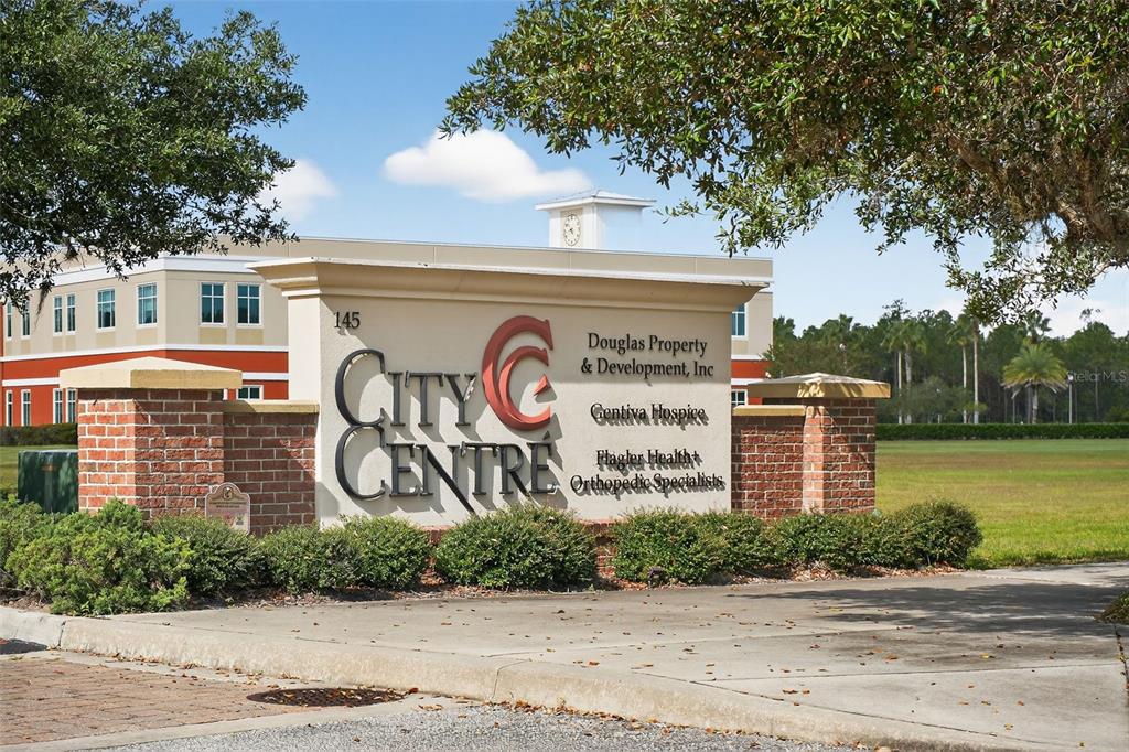 469 Bulldog Drive, Unit 1 Palm Coast, FL 32164 - Photo 21 of 54 a sign that is on a brick wall