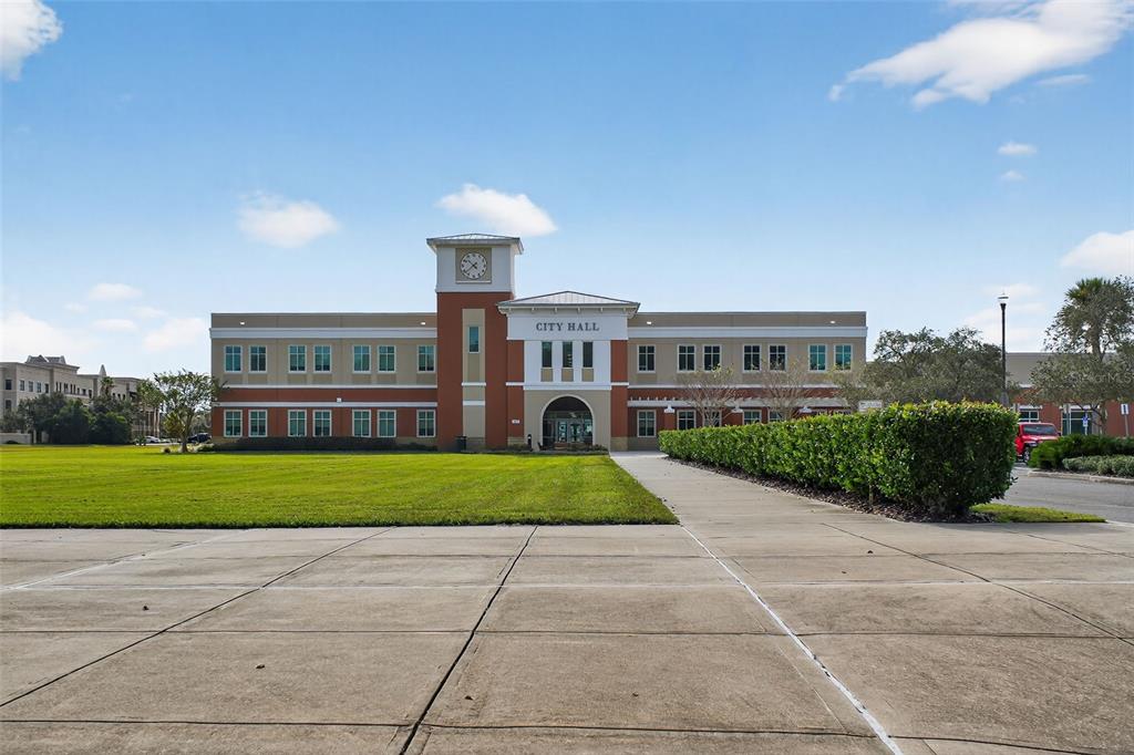 469 Bulldog Drive, Unit 1 Palm Coast, FL 32164 - Photo 8 of 54 a front view of a house with a yard and outdoor seating