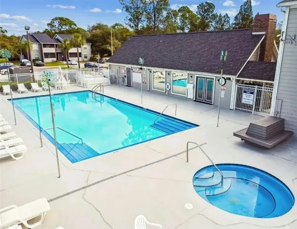 a view of a swimming pool with a patio