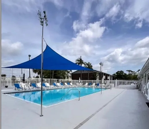 a view of a swimming pool with a patio