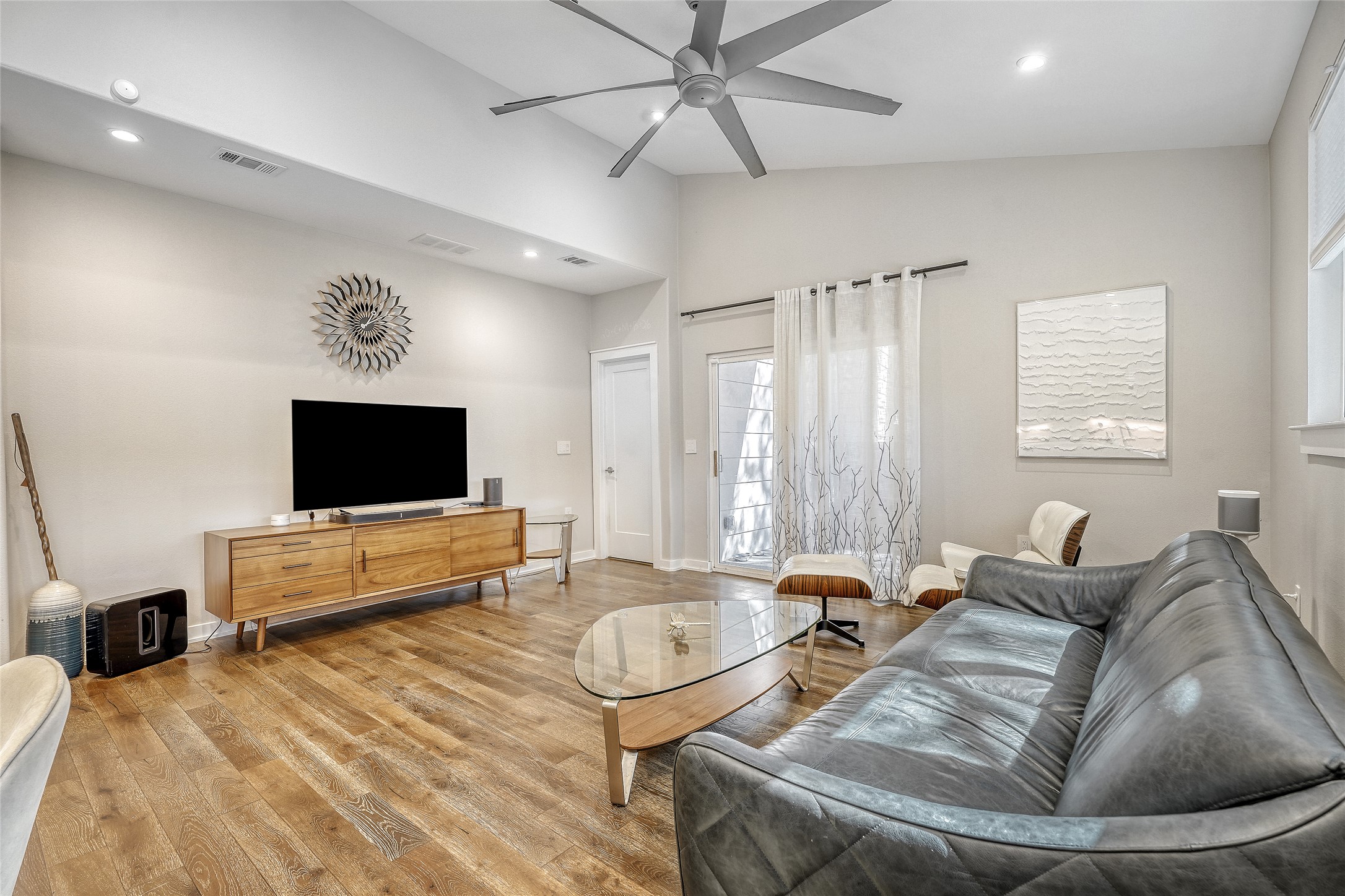 6800 Menchaca Road, Unit 5 Austin, TX 78745 - Photo 11 of 28 a living room with furniture and a flat screen tv