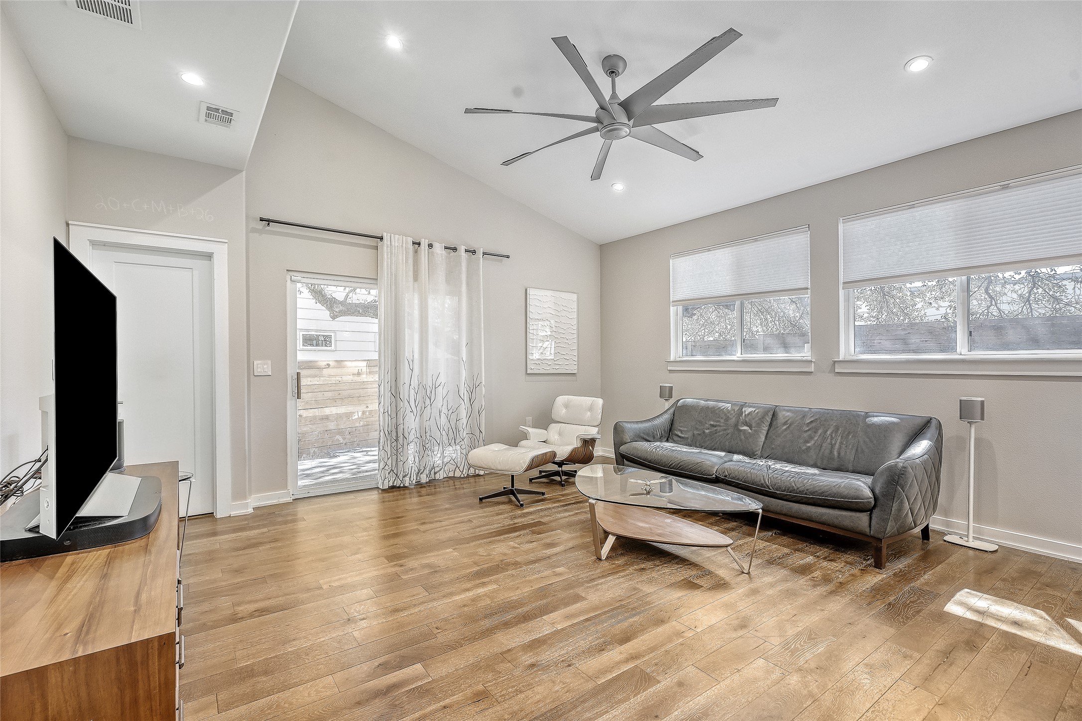 6800 Menchaca Road, Unit 5 Austin, TX 78745 - Photo 13 of 28 a living room with furniture and a flat screen tv