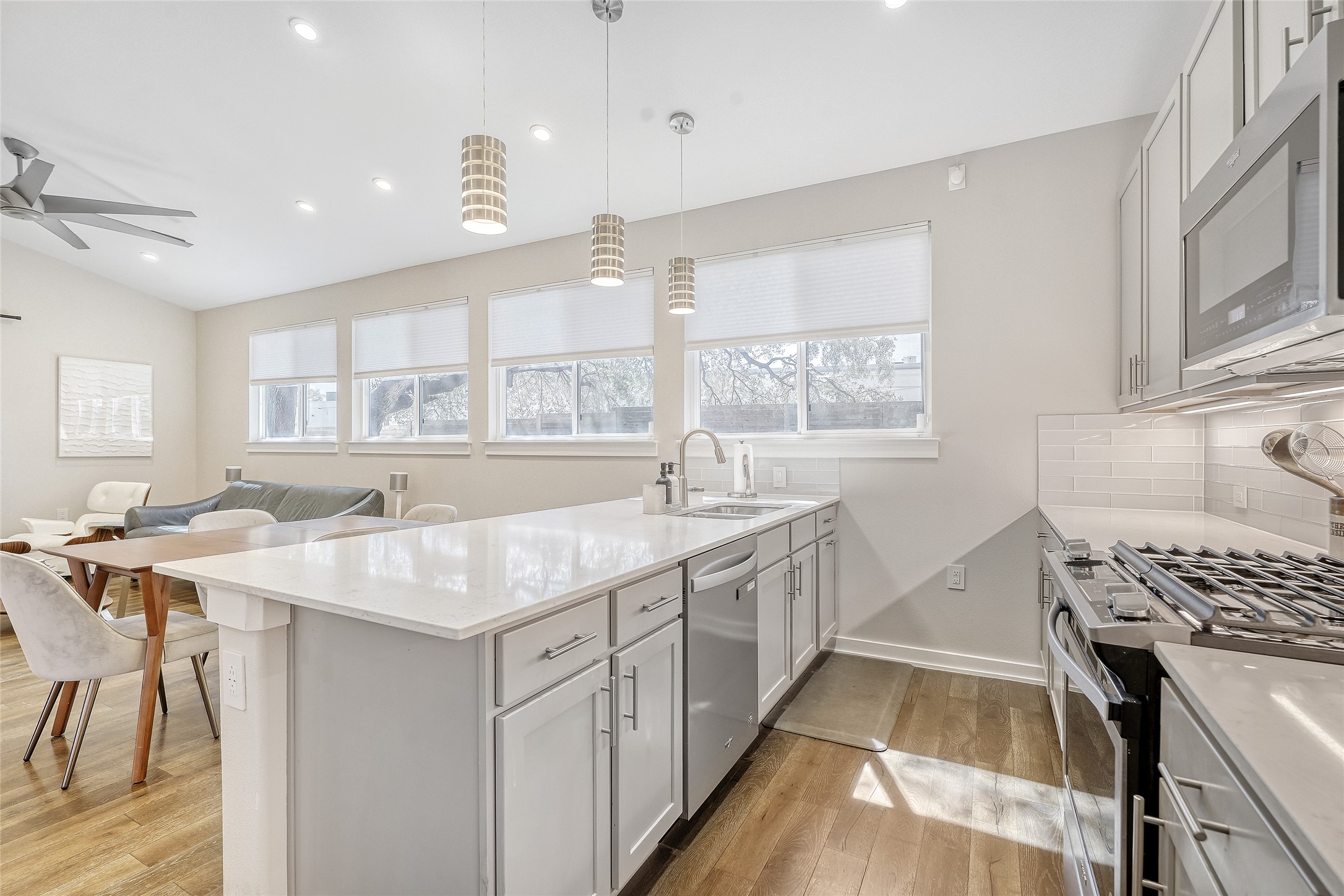 6800 Menchaca Road, Unit 5 Austin, TX 78745 - Photo 16 of 28 a kitchen with stainless steel appliances granite countertop a sink stove and cabinets