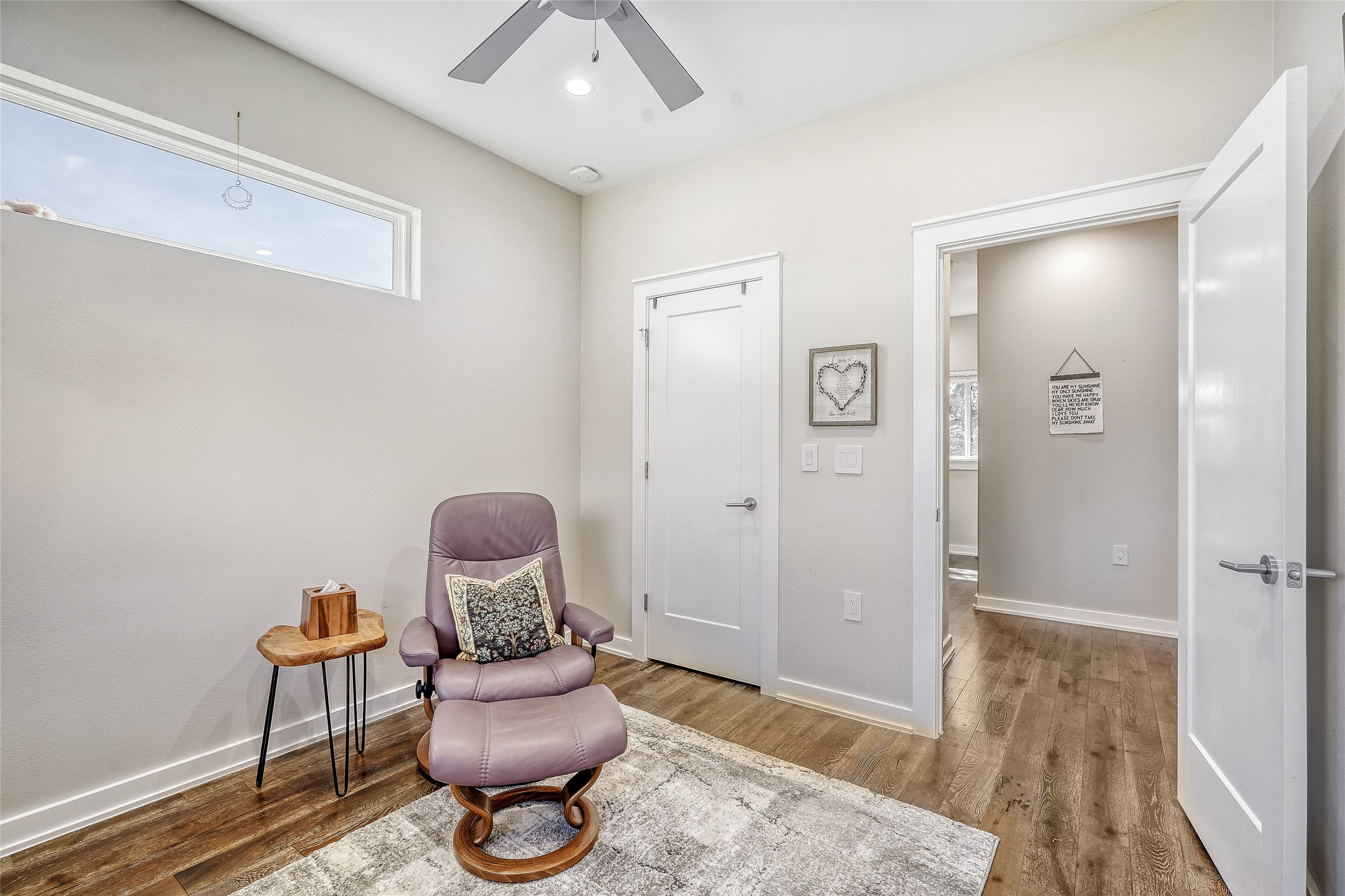 6800 Menchaca Road, Unit 5 Austin, TX 78745 - Photo 18 of 28 a room with furniture and a wooden floor