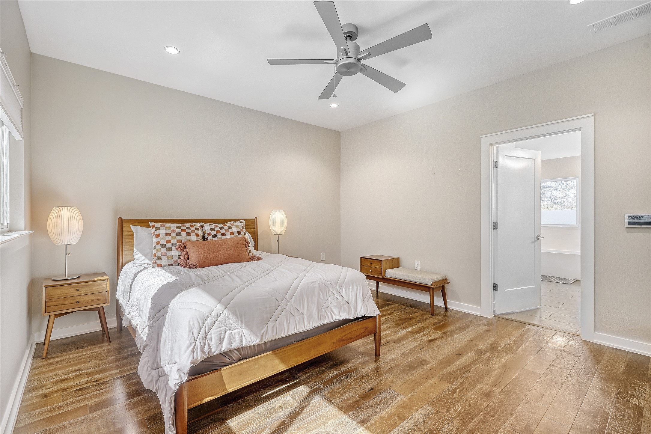 6800 Menchaca Road, Unit 5 Austin, TX 78745 - Photo 20 of 28 a bedroom with a bed and a chandelier