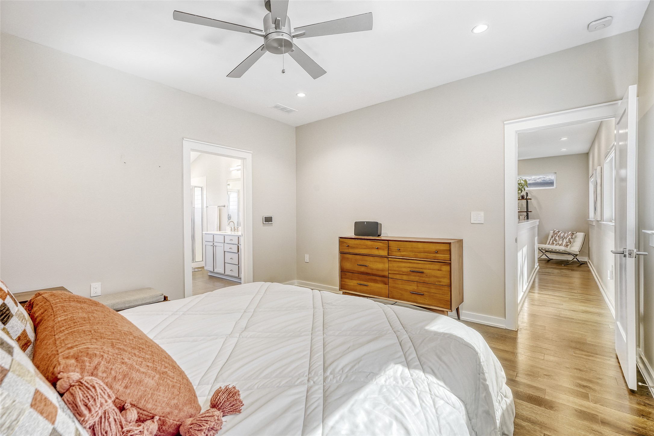 6800 Menchaca Road, Unit 5 Austin, TX 78745 - Photo 21 of 28 a bedroom with a bed and a chandelier