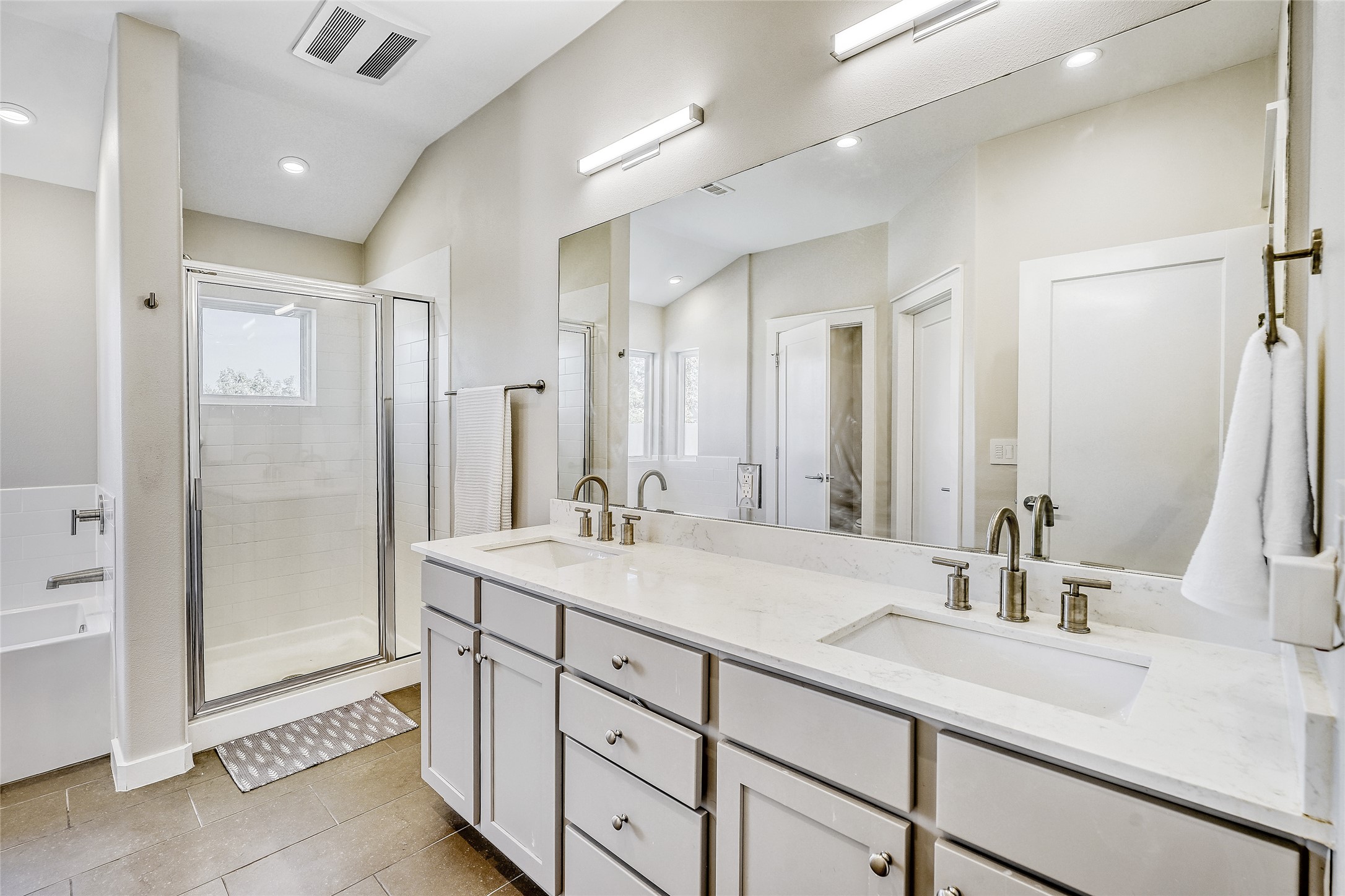 6800 Menchaca Road, Unit 5 Austin, TX 78745 - Photo 26 of 28 a bathroom with a shower sink double and mirror