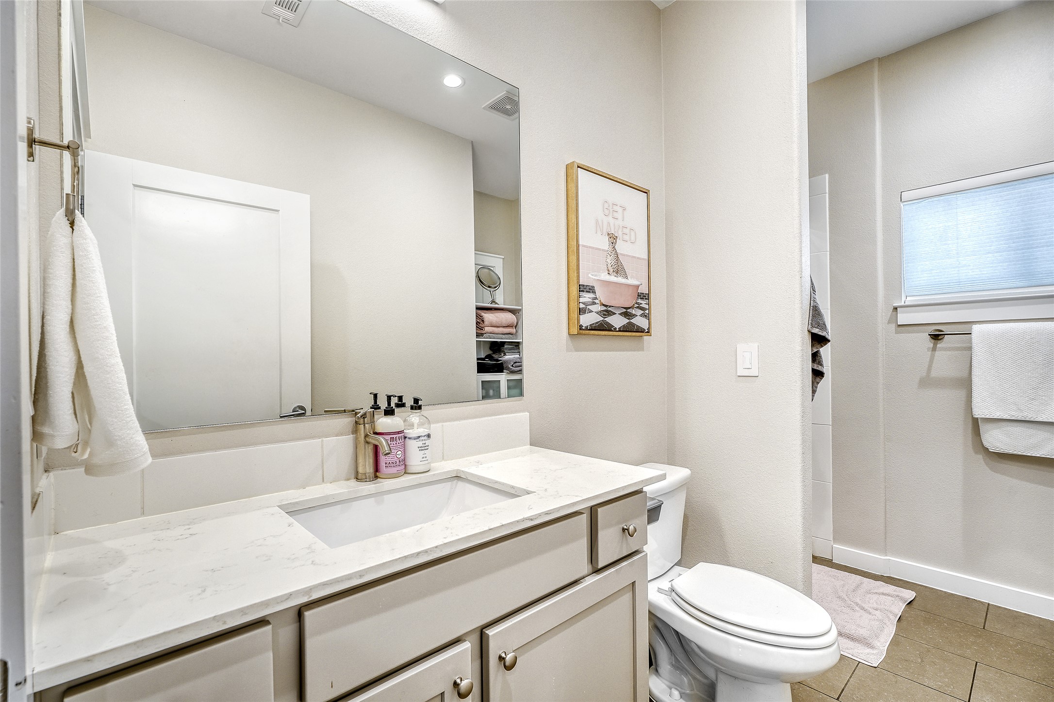 6800 Menchaca Road, Unit 5 Austin, TX 78745 - Photo 28 of 28 a bathroom with a sink a toilet a shower and a mirror