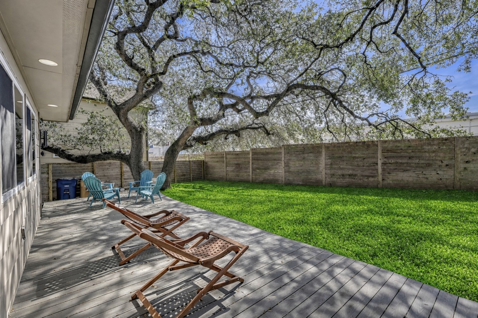 6800 Menchaca Road, Unit 5 Austin, TX 78745 - Photo 5 of 28 a bench is sitting in middle of the grass
