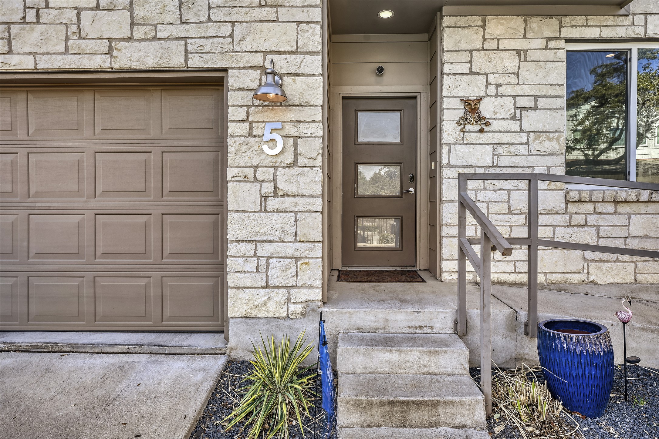 6800 Menchaca Road, Unit 5 Austin, TX 78745 - Photo 8 of 28 a view of a door of the house with a chair and potted plant