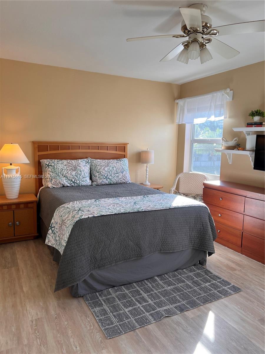 2600 North Surf Road, Unit 403 Hollywood, FL 33019 - Photo 14 of 24 a bedroom with a bed and window
