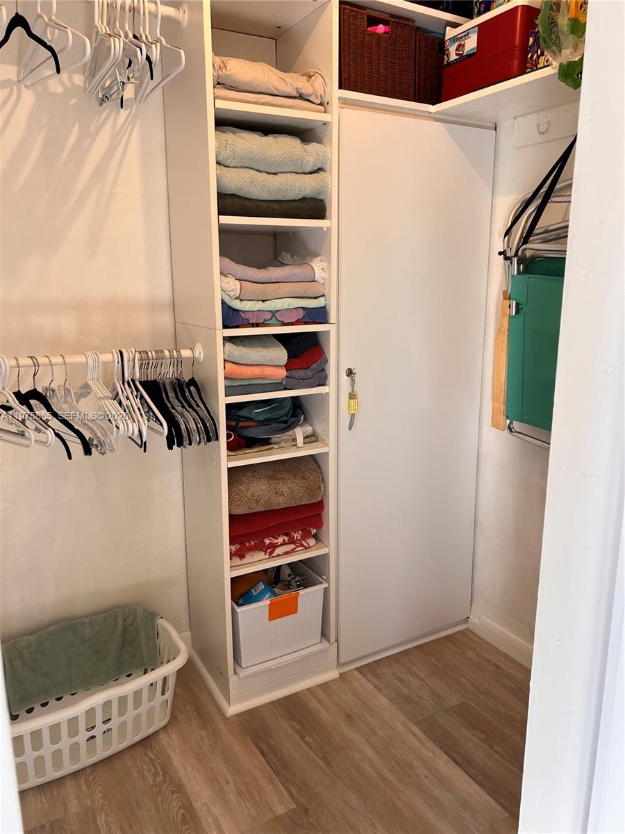 2600 North Surf Road, Unit 403 Hollywood, FL 33019 - Photo 17 of 24 a view of walk in closet with clothes and shoes