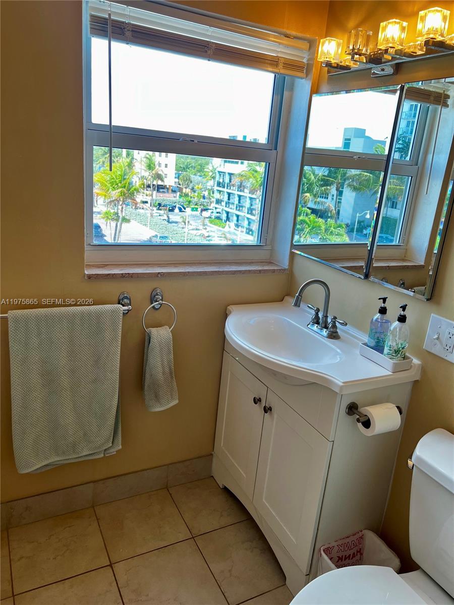2600 North Surf Road, Unit 403 Hollywood, FL 33019 - Photo 19 of 24 a bathroom with a sink and mirror