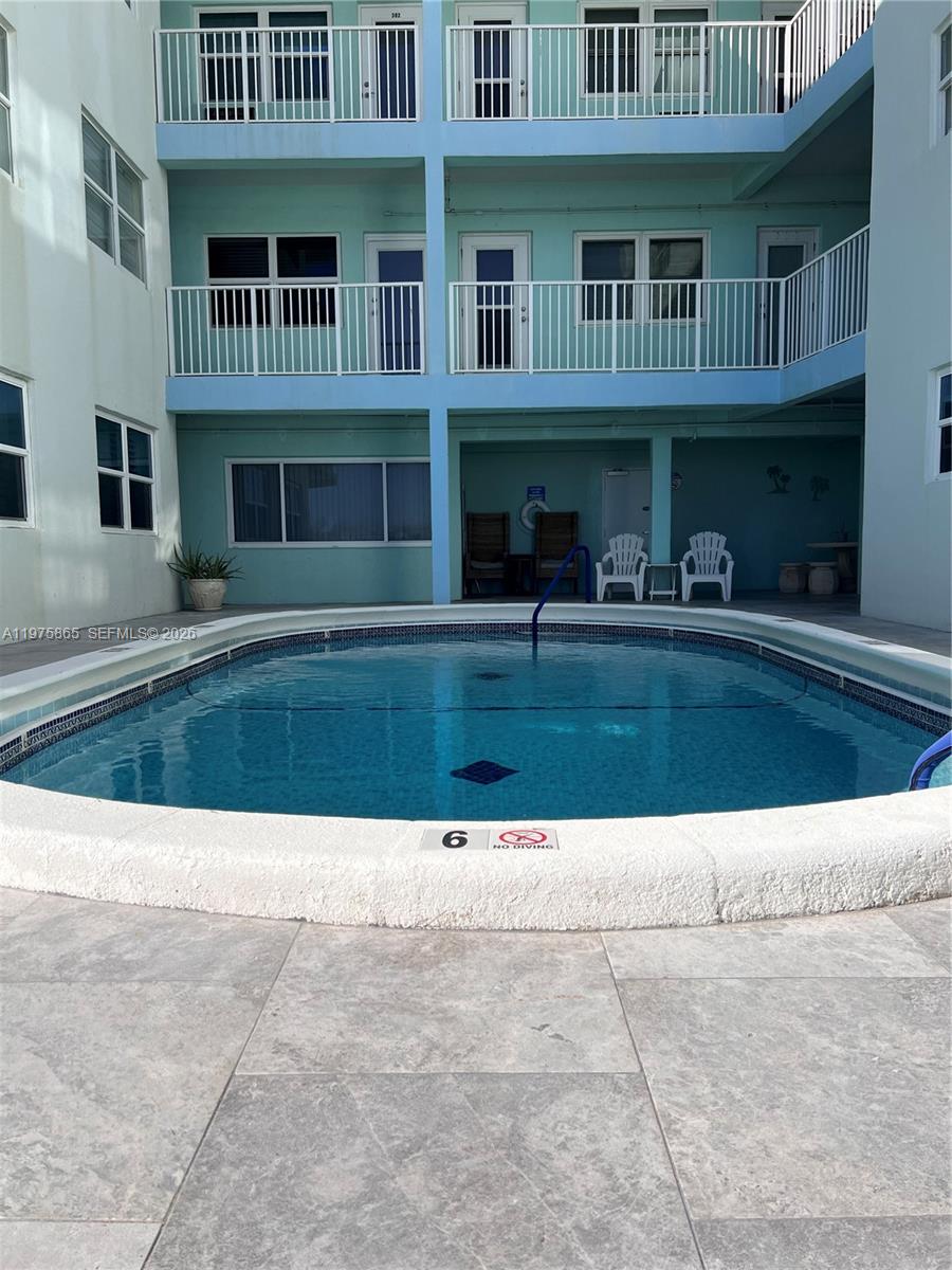 2600 North Surf Road, Unit 403 Hollywood, FL 33019 - Photo 22 of 24 a view of an buildings with swimming pool