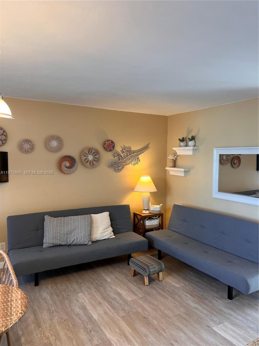 2600 North Surf Road, Unit 403 Hollywood, FL 33019 - Photo 5 of 24 a living room with a couch and a coffee table