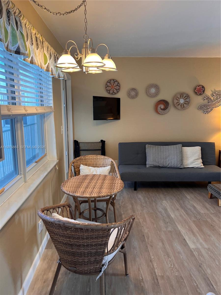 2600 North Surf Road, Unit 403 Hollywood, FL 33019 - Photo 6 of 24 a living room with furniture and a wooden floor