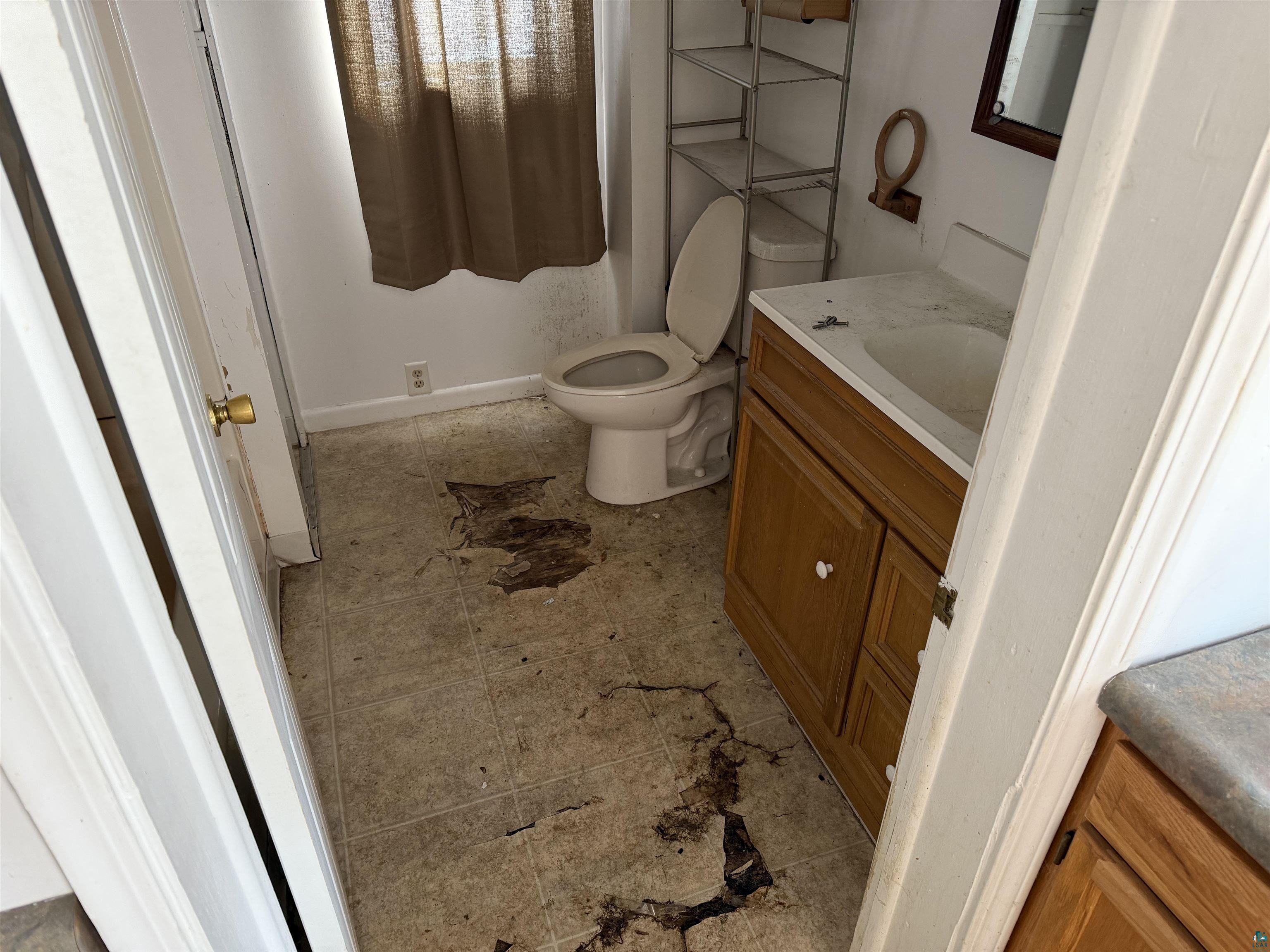 1720 Iowa Avenue Superior, WI 54880 - Photo 9 of 11 Bathroom with vanity and baseboards