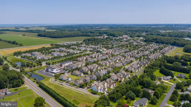 an aerial view of residential building and lake