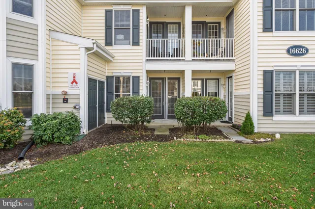 a view of a house with a yard and plants