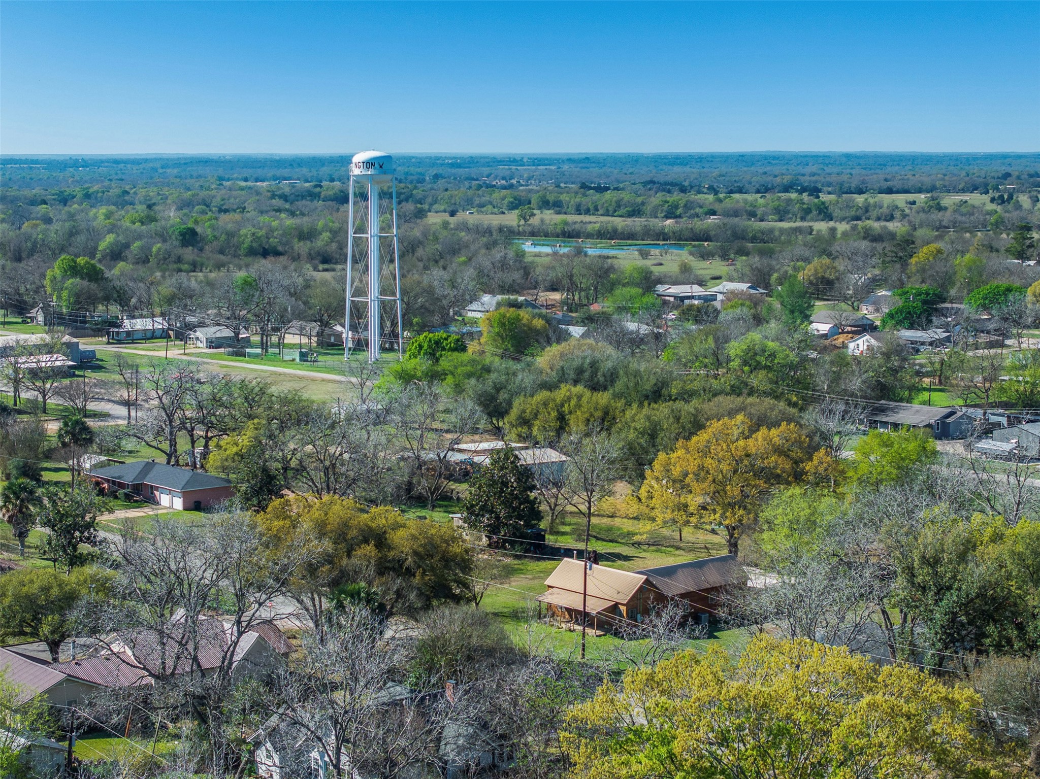 809 Main Street Lexington, TX 78947 - Photo 6 of 23 a view of a garden with a lake