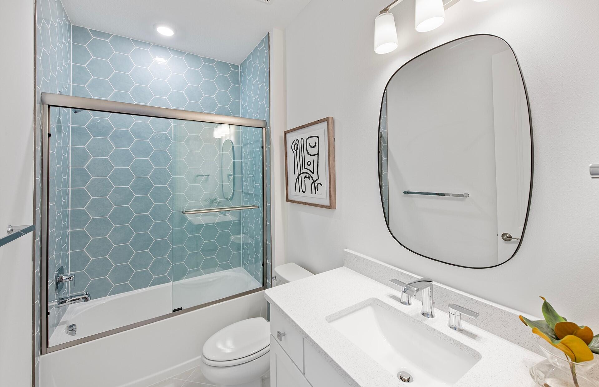 10391 Southwest Highpointe Drive, Unit HIGHGATE 265 Stuart, FL 34997 - Photo 18 of 31 a bathroom with a sink a toilet and shower