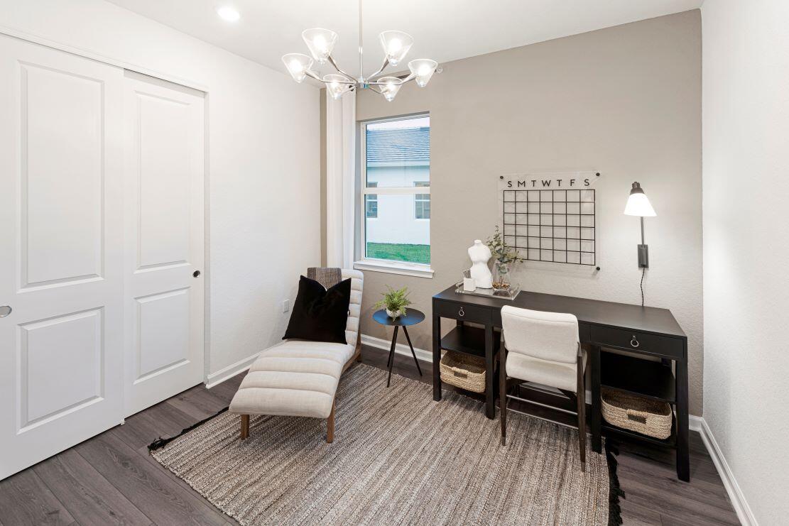 10391 Southwest Highpointe Drive, Unit HIGHGATE 265 Stuart, FL 34997 - Photo 20 of 31 a living room with furniture a window and a table
