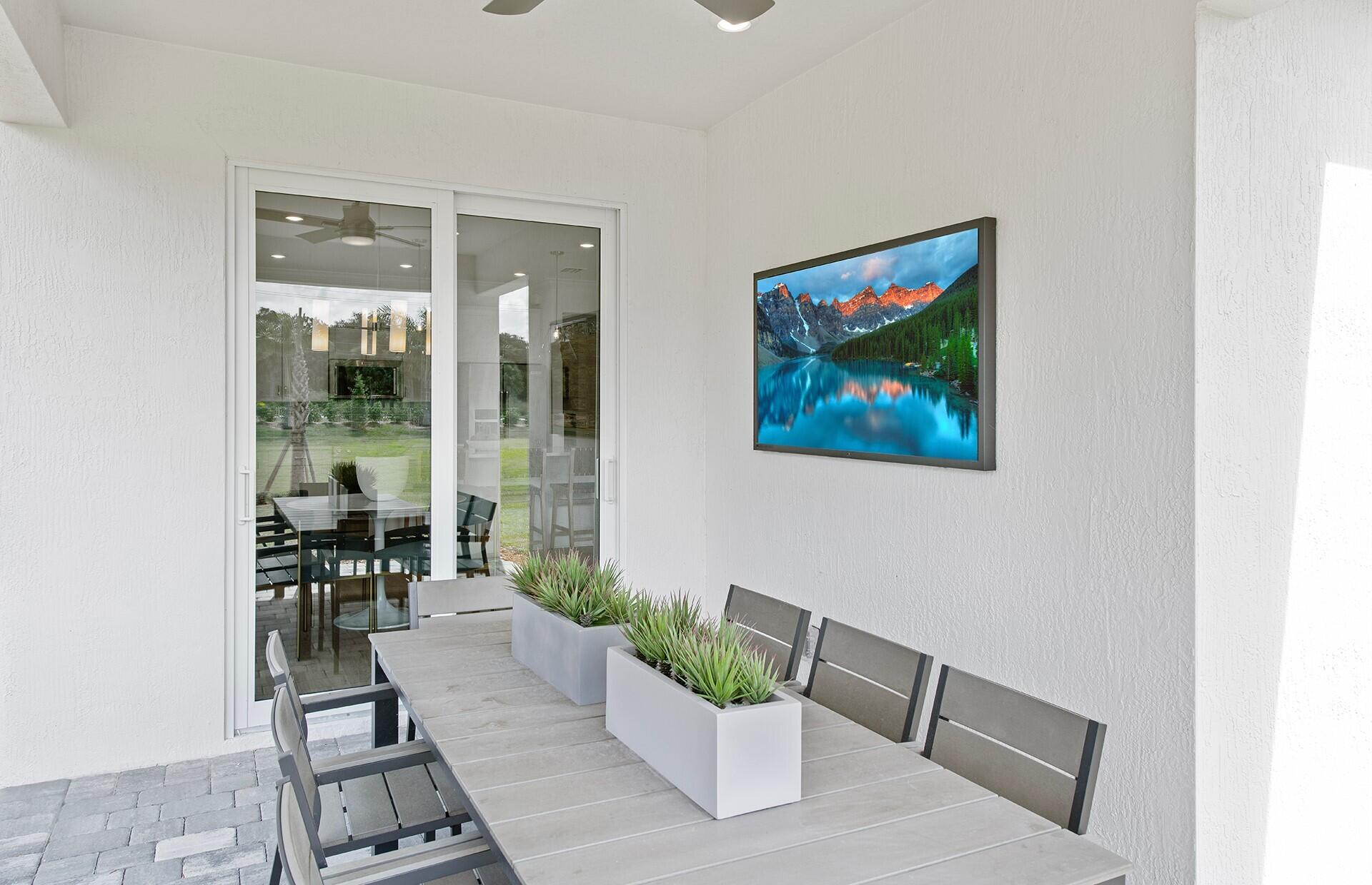 10391 Southwest Highpointe Drive, Unit HIGHGATE 265 Stuart, FL 34997 - Photo 21 of 31 a living room with furniture and a potted plant