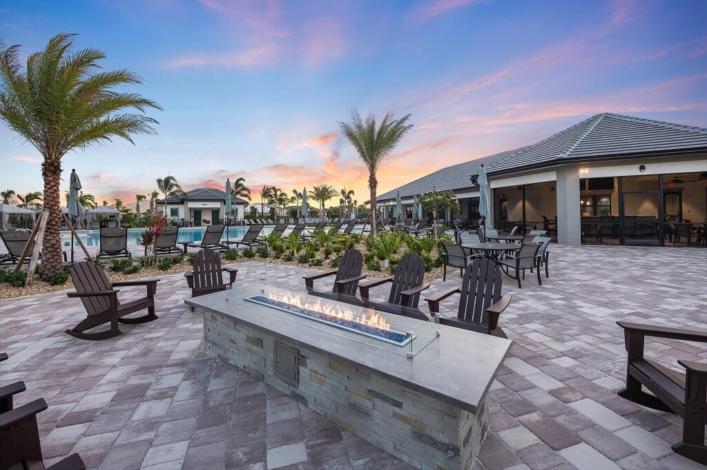 10391 Southwest Highpointe Drive, Unit HIGHGATE 265 Stuart, FL 34997 - Photo 27 of 31 a view of a chairs and table in a patio