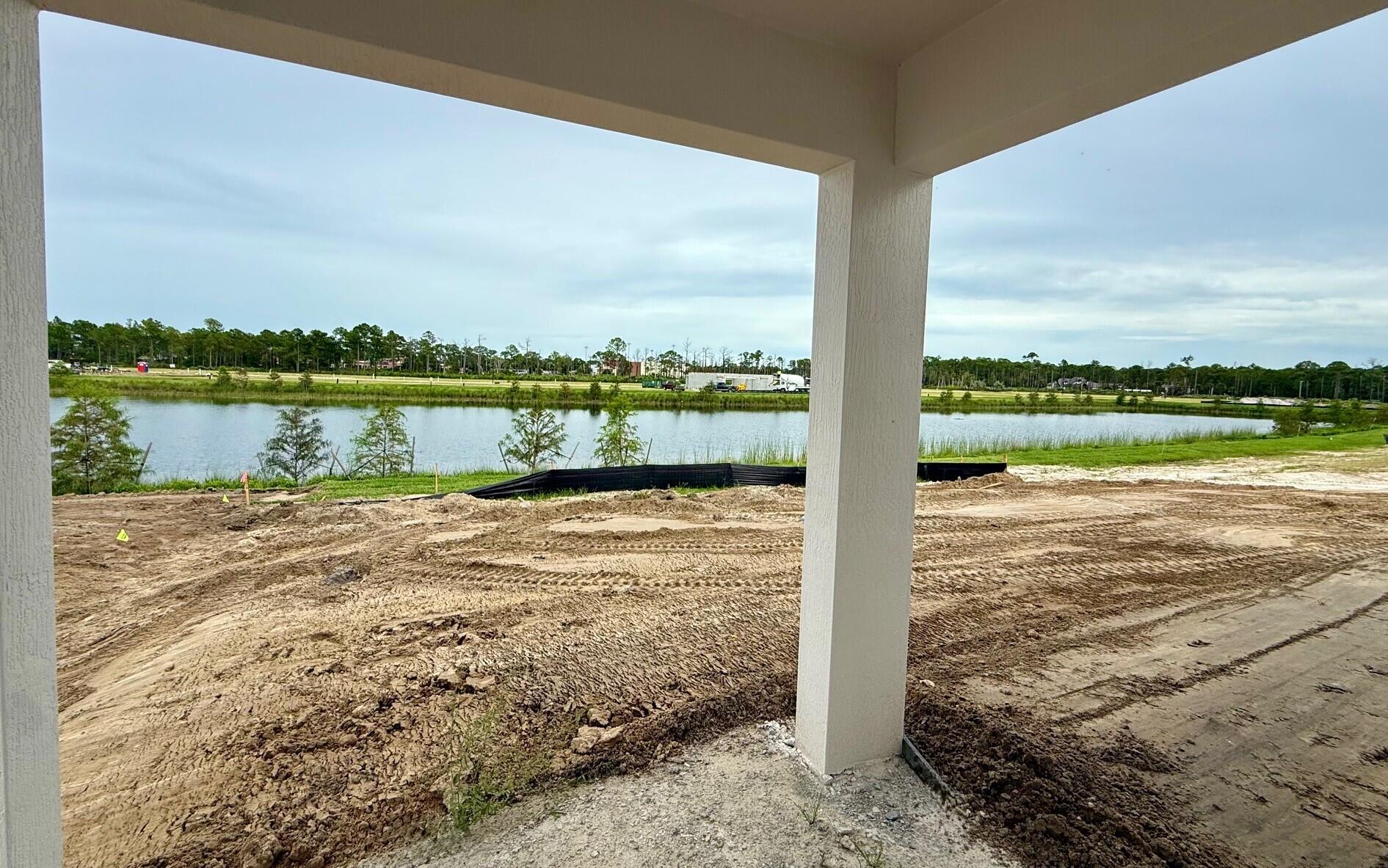 10391 Southwest Highpointe Drive, Unit HIGHGATE 265 Stuart, FL 34997 - Photo 3 of 31 a view of a lake from a city view