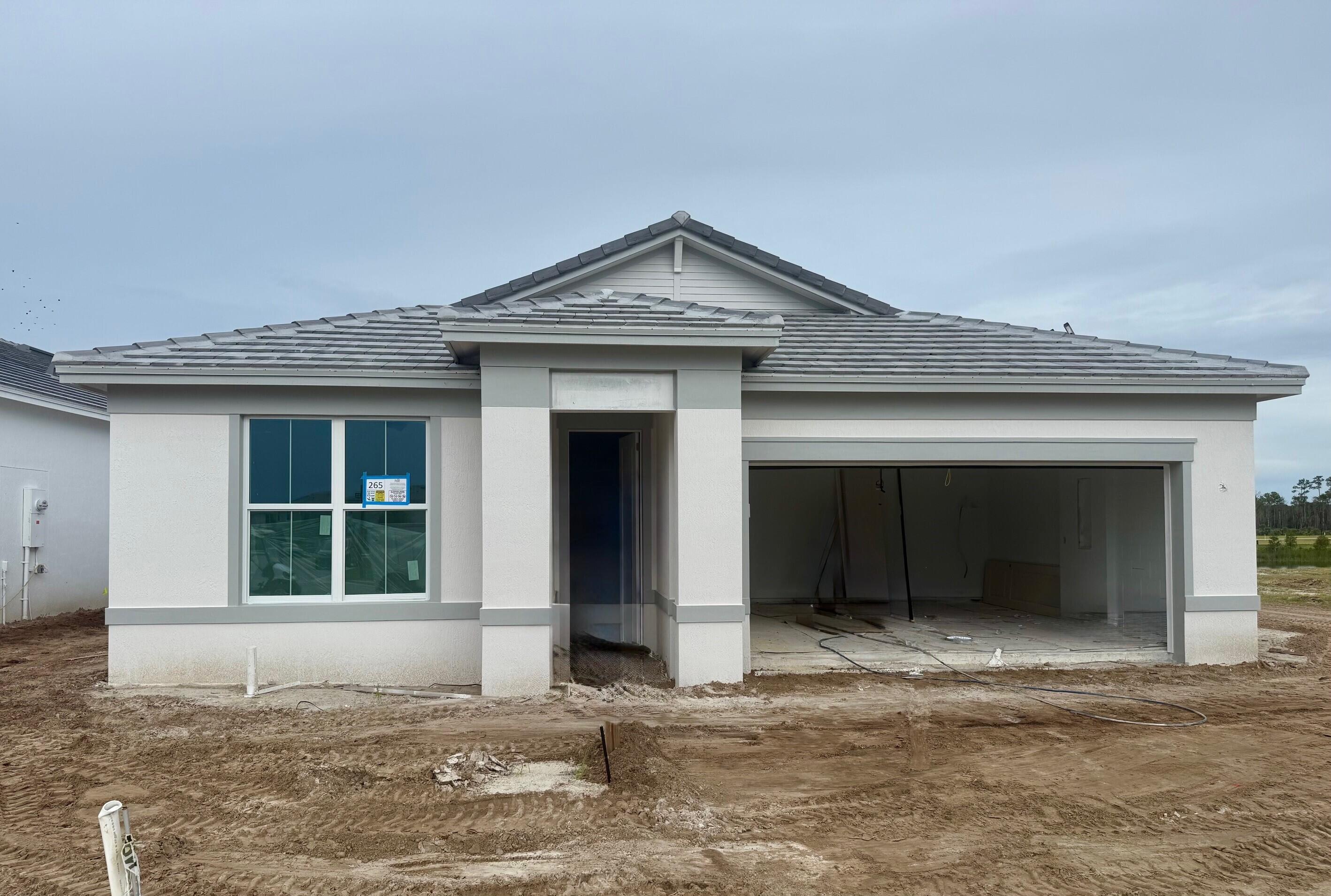10391 Southwest Highpointe Drive, Unit HIGHGATE 265 Stuart, FL 34997 - Photo 4 of 31 a view of a house with a window