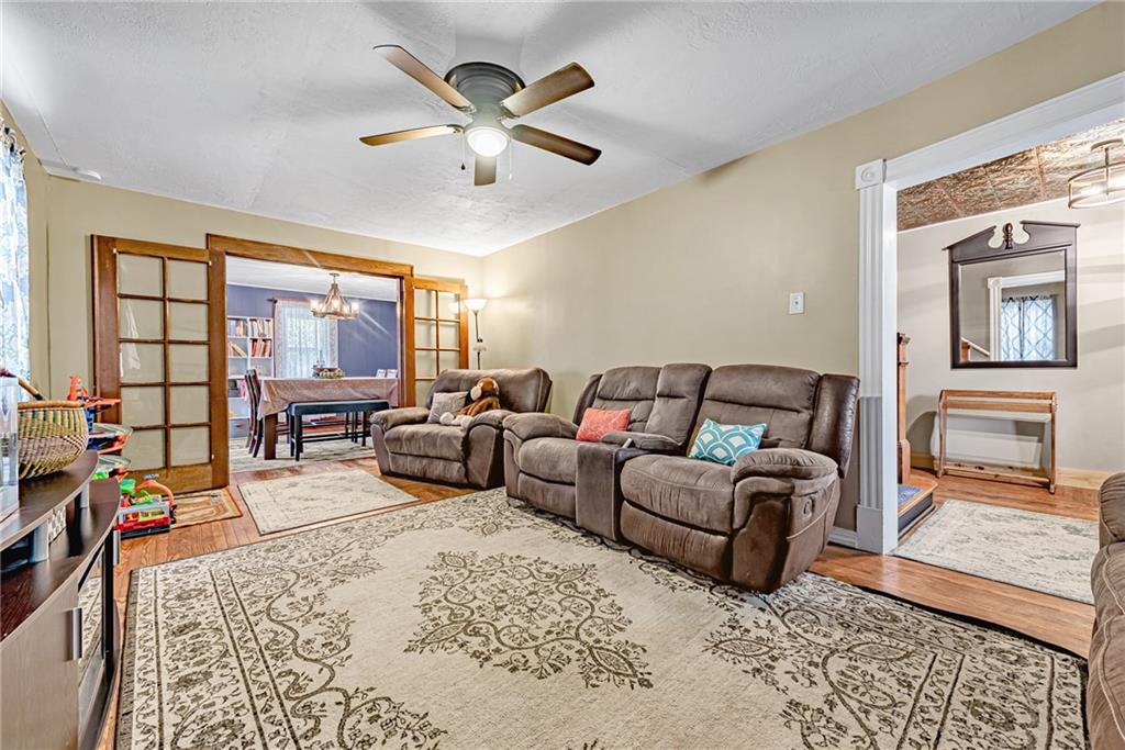 2096 Indian Head Road Normalville, PA 15469 - Photo 6 of 24 a living room with furniture ceiling fan and a rug