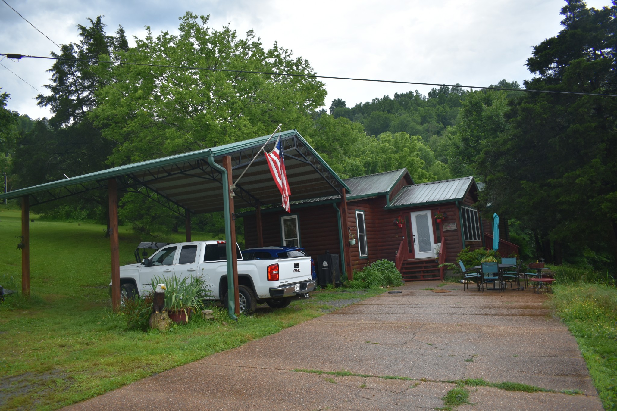 424 Wilderness Trail Road Granville, TN 38564 - Photo 2 of 16 a view of a house with backyard and sitting area