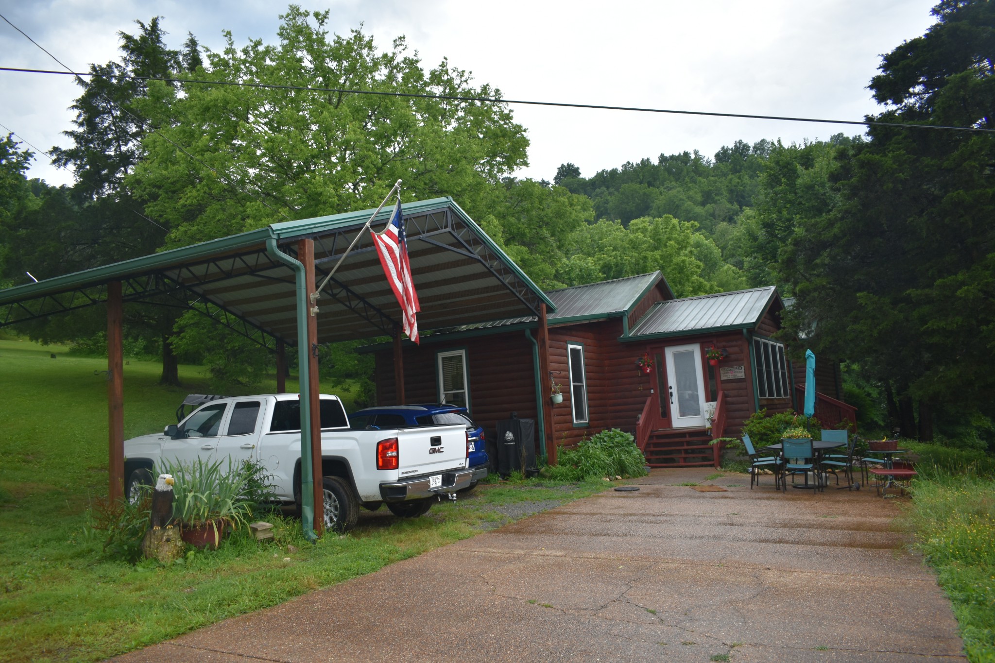 424 Wilderness Trail Road Granville, TN 38564 - Photo 3 of 16 a front view of a house with garden