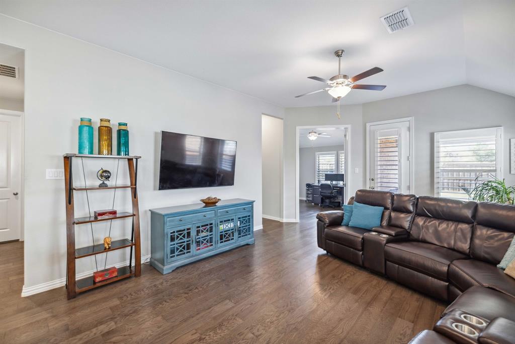 1732 Wassel Road Fort Worth, TX 76052 - Photo 14 of 39 a living room with furniture and a flat screen tv