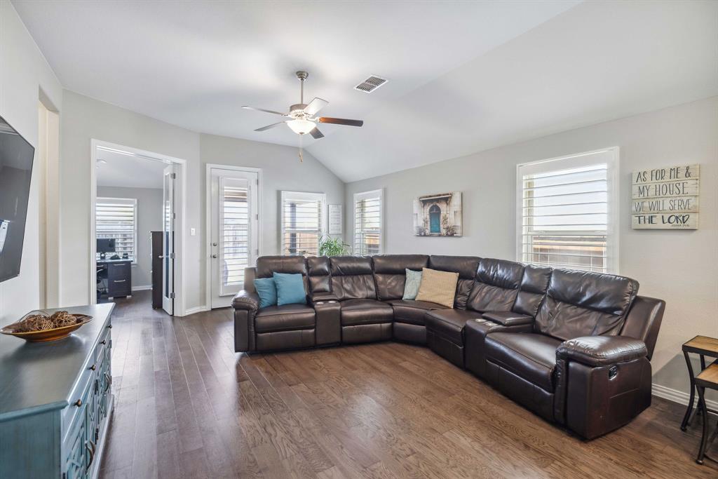 1732 Wassel Road Fort Worth, TX 76052 - Photo 15 of 39 a living room with furniture a ceiling fan a lamp and a window