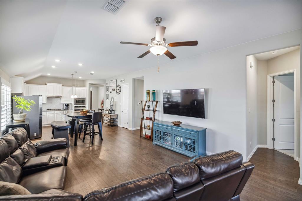 1732 Wassel Road Fort Worth, TX 76052 - Photo 16 of 39 a living room with furniture and a flat screen tv