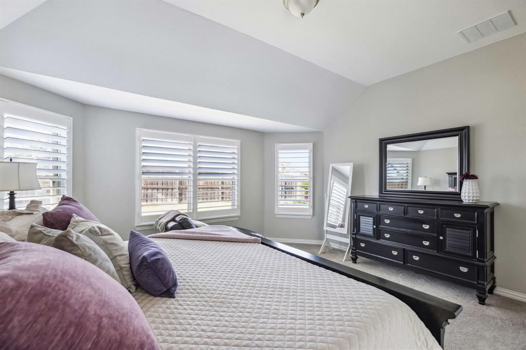 1732 Wassel Road Fort Worth, TX 76052 - Photo 22 of 39 a bedroom with a bed a window and dresser