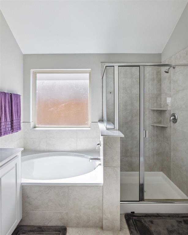 1732 Wassel Road Fort Worth, TX 76052 - Photo 26 of 39 a bathroom with a bathtub and a shower