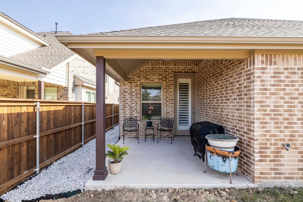 1732 Wassel Road Fort Worth, TX 76052 - Photo 36 of 39 a front view of a house with outdoor seating