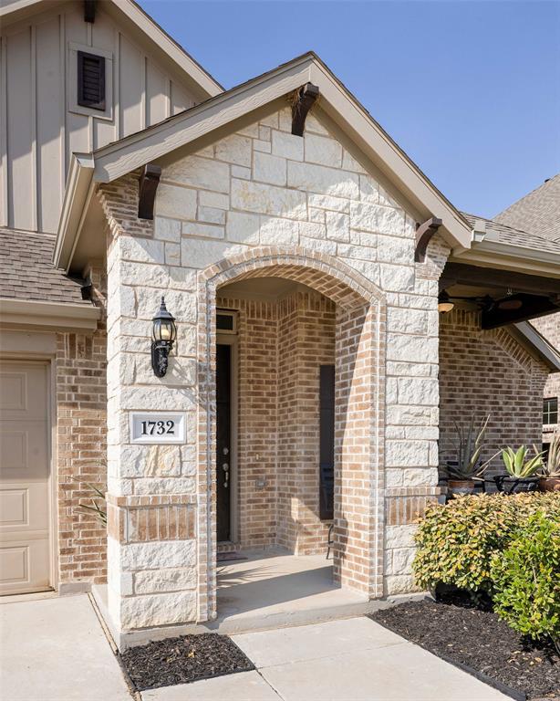 1732 Wassel Road Fort Worth, TX 76052 - Photo 4 of 39 a front view of a house with a garage