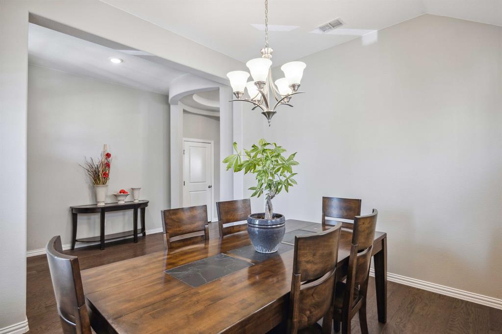 1732 Wassel Road Fort Worth, TX 76052 - Photo 5 of 39 a view of a dining room with furniture and chandelier