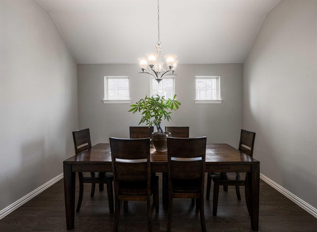 1732 Wassel Road Fort Worth, TX 76052 - Photo 7 of 39 a dining room with furniture and chandelier