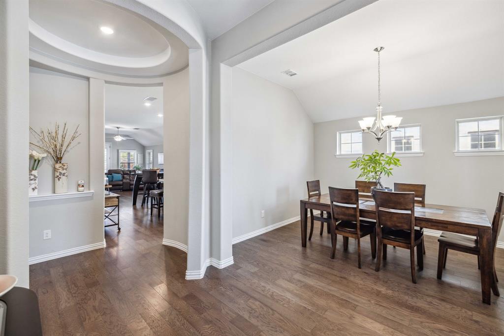 1732 Wassel Road Fort Worth, TX 76052 - Photo 8 of 39 a view of a dining room with furniture window and wooden floor