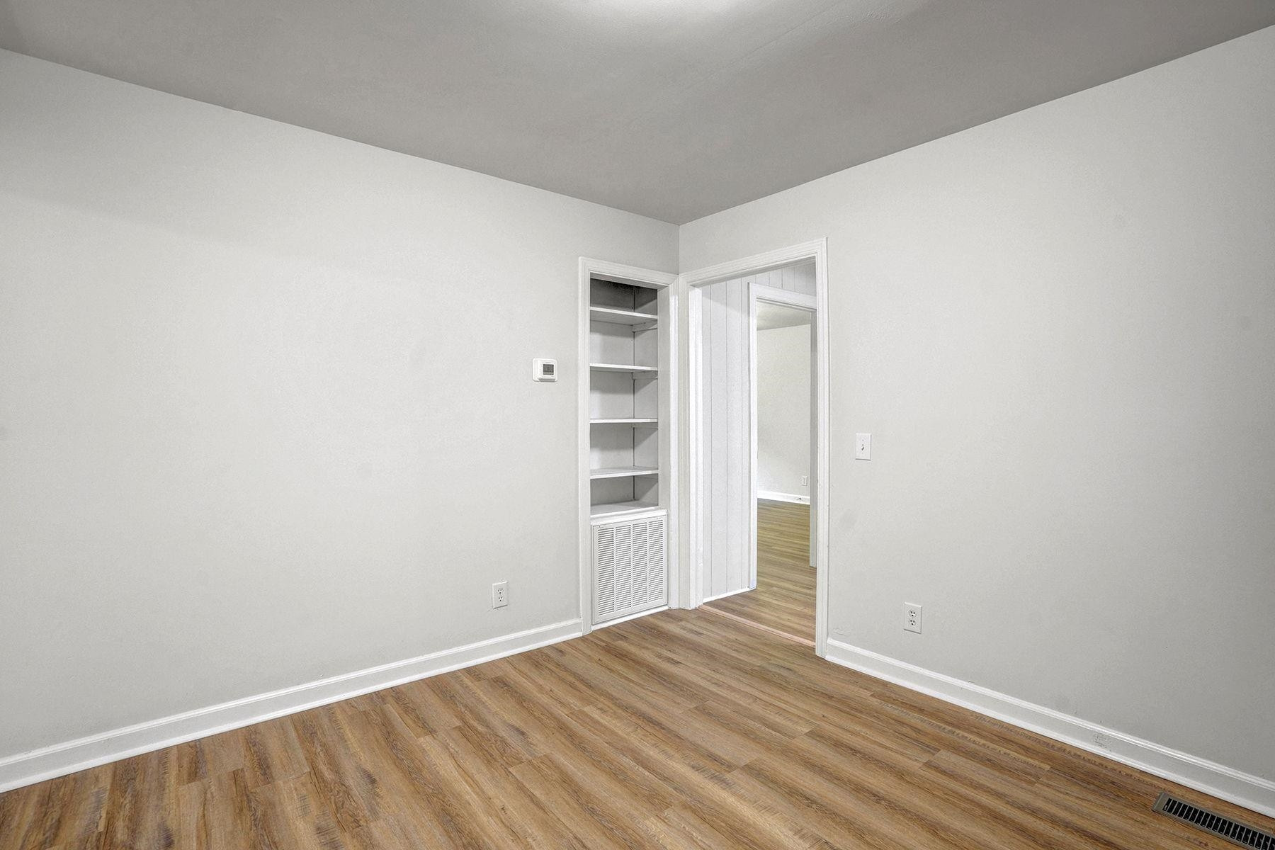 170 Temple Road Bunnlevel, NC 28323 - Photo 12 of 34 a view of an empty room with wooden floor