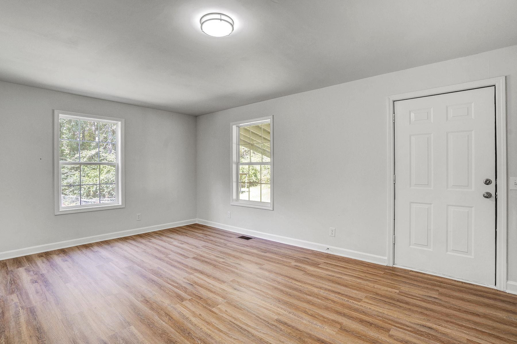 170 Temple Road Bunnlevel, NC 28323 - Photo 15 of 34 a view of an empty room with wooden floor and a window