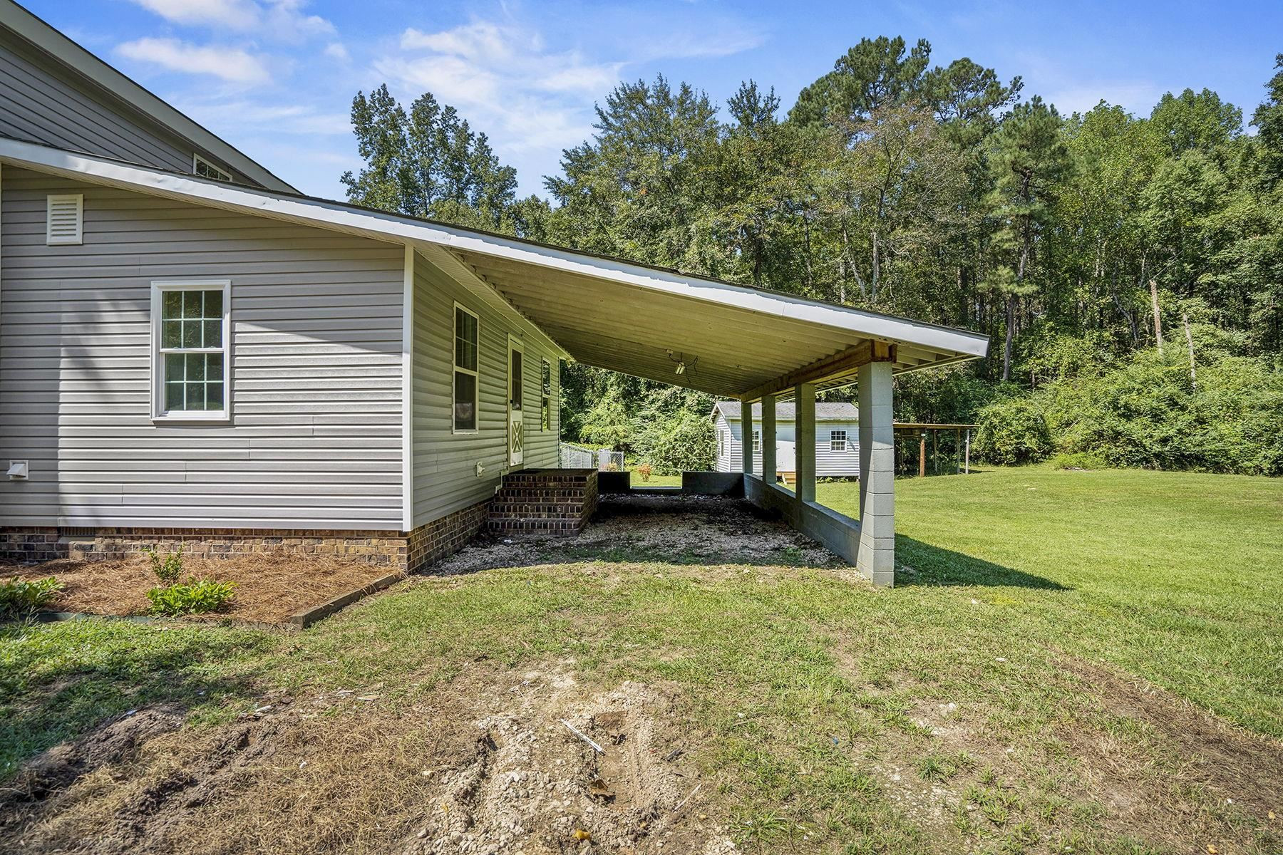 170 Temple Road Bunnlevel, NC 28323 - Photo 25 of 34 a view of a house with backyard and sitting area